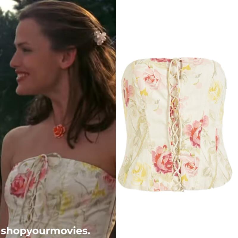 Jennifer Garner as Jenna Rink wearing a cream floral bustier top in 13 Going on 30.